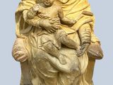 statue of a woman holding a baby in her arms