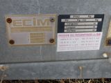 a metal box with a sign on it that says elim