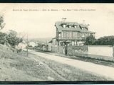 a black and white photo of a house on the side of the road