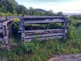 a fence that has a bunch of wood in it