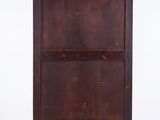 an old wooden cabinet with two doors and a drawer underneath it