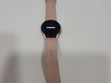 a close up of a samsung watch on a white surface