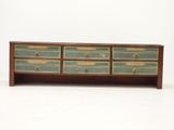 an image of a wooden dresser with four drawers on top of it