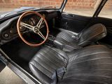 a black car with leather seats and a steering wheel