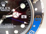 a close up of a wrist watch with a blue bezel