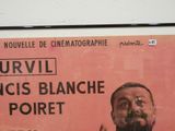 a poster of a man with a beard on a wall