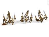 four light wall sconces in the shape of a chandelier