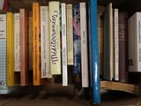 a cardboard box with a bunch of books on it
