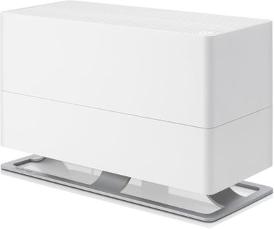 un purificateur d'air blanc posé sur un socle métallique