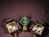 three small lights are sitting on top of a purple surface