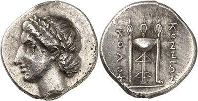 a silver coin with an image of a woman on it