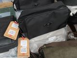 several pieces of luggage sitting on top of a table covered in plastic