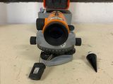 a close up of a surveying device on a table in a room