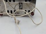 a white electrical device that is connected to a white cord