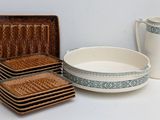 many plates and bowls that are sitting on a table