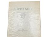 un drap blanc sur lequel sont inscrits les mots « Christ noir »