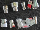 many different types of hoses and fittings on the floor