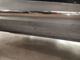 a close up of a car door handle with a sticker on it