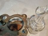 a glass candle holder and a glass candle holder on a table