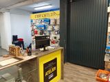 an image of a store with a counter in the middle of the room