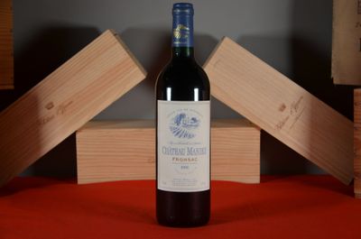 a bottle of wine that is sitting on a table