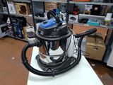 a vacuum that is sitting on a table in a room