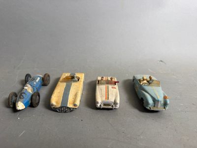 several toy cars are lined up in a row on a table