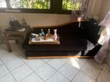 a couch that has a tray on top of it