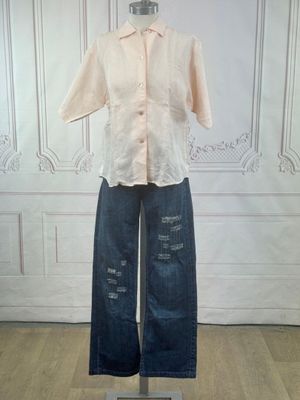 an image of a mannequin wearing a shirt and jeans