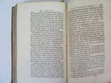 an open book that is sitting on a table