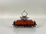 a toy train on a white surface with a white background
