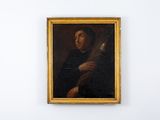 portrait d'un homme tenant une guitare, à côté d'un tableau accroché au mur
