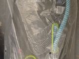a blue rope wrapped in plastic on the ground