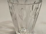 a clear glass vase sitting on a white surface