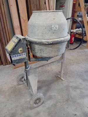 concrete mixer sitting in a garage with a number 59 on the side