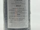 a bottle of wine that is wrapped in plastic