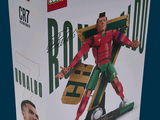 a box with a lego figure of a man on a skateboard