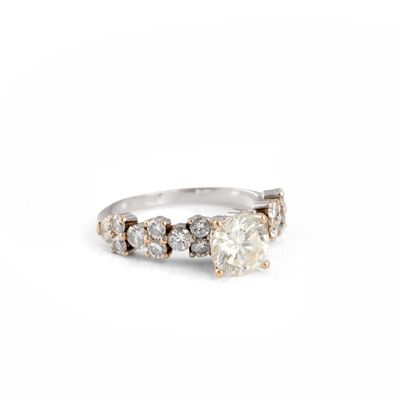 a close up of a diamond ring on a white background