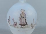 a white vase with a picture of a woman and animals on it