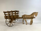 an old wooden horse drawn carriage with a wooden seat