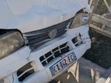 a white van that has been involved in a car accident