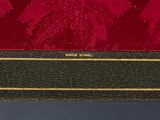 an image of a red and green purse with a gold trim