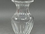 a glass vase that is sitting on a table