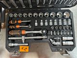 many tools in a tool case on the floor