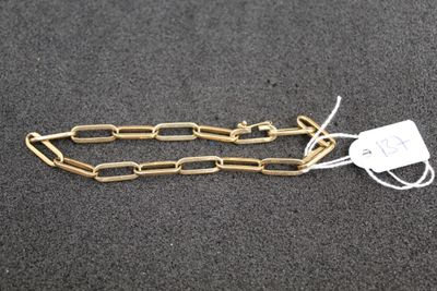 a close up of a chain with a tag attached to it