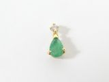 a close up of a pair of earrings with a green tear shaped stone