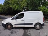 a white van parked on the side of the road