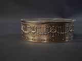 an image of a gold ring on a black surface