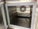 an image of a stainless steel oven with the door open