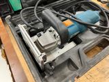 a drill in the case with a cord in it